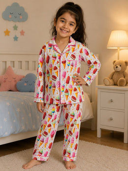 Child wearing a colorful playful print pajama set
