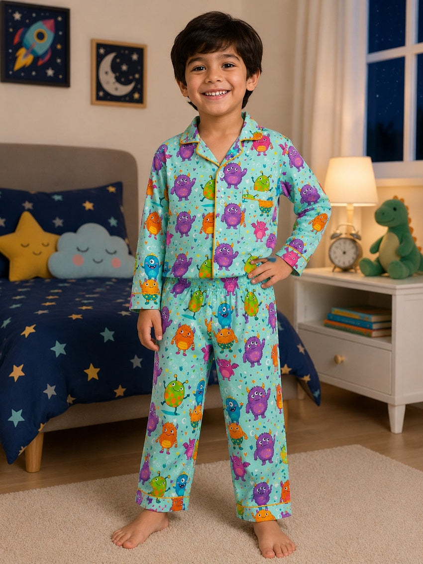 Child wearing a colorful rainbow and dinosaur print pajama set